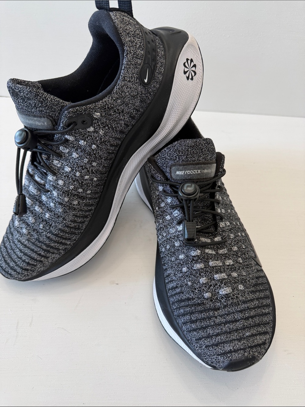 Nike Women's Black and Gray Knit Slip-On Running Sneakers